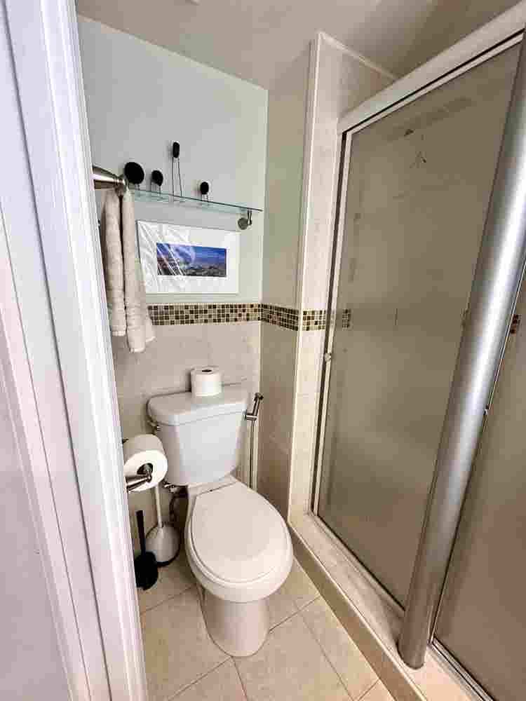 A basement level furnished bedroom.