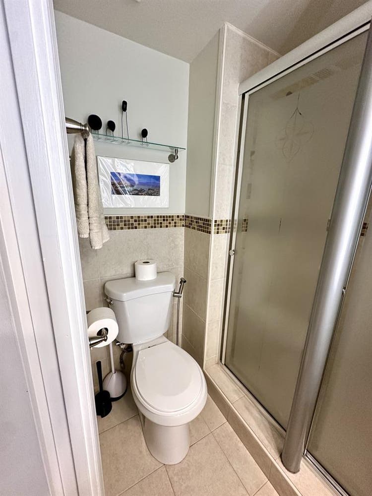 A basement level furnished bedroom.