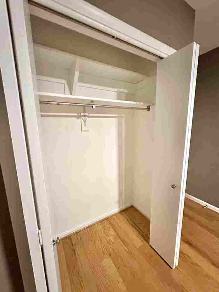 A basement level furnished bedroom.