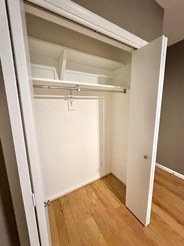 A basement level furnished bedroom.