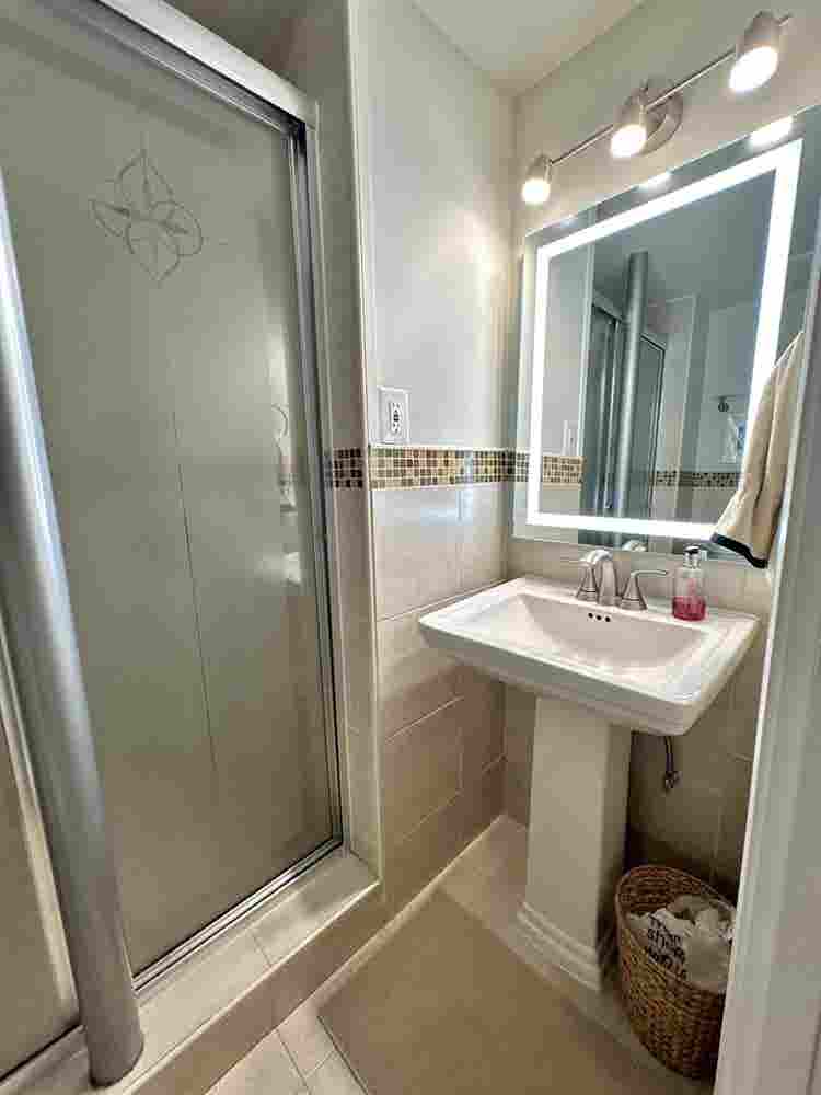 A basement level furnished bedroom.