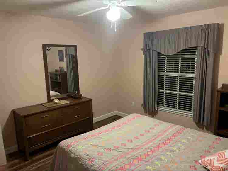 Furnished bedroom with private bath