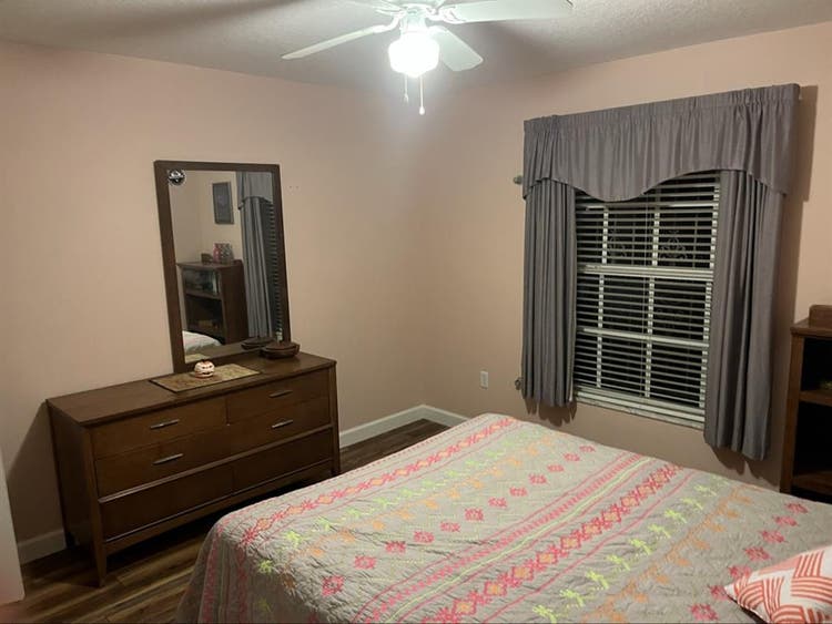 Furnished bedroom with private bath