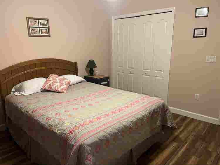 Furnished bedroom with private bath