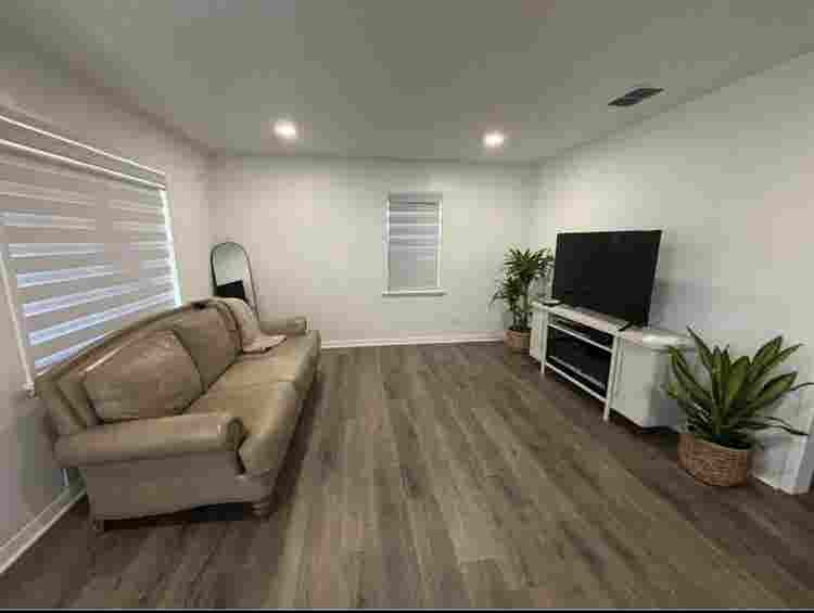 Large furnished room with bathroom