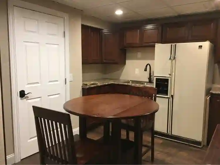 Room, private bathroom and kitchen