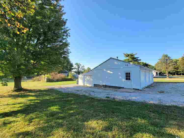 Farmhouse + acreage in the City
