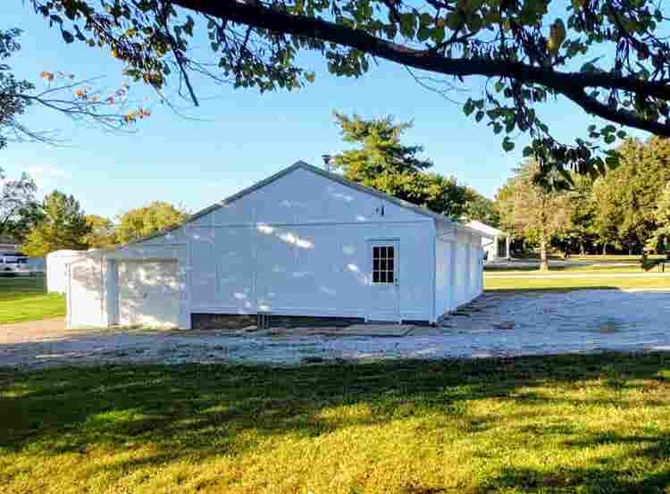 Farmhouse + acreage in the City