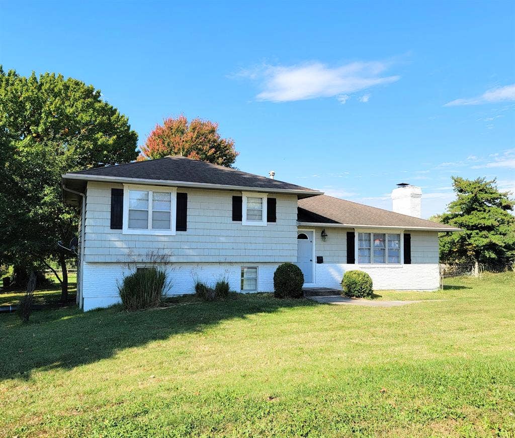 Farmhouse + acreage in the City