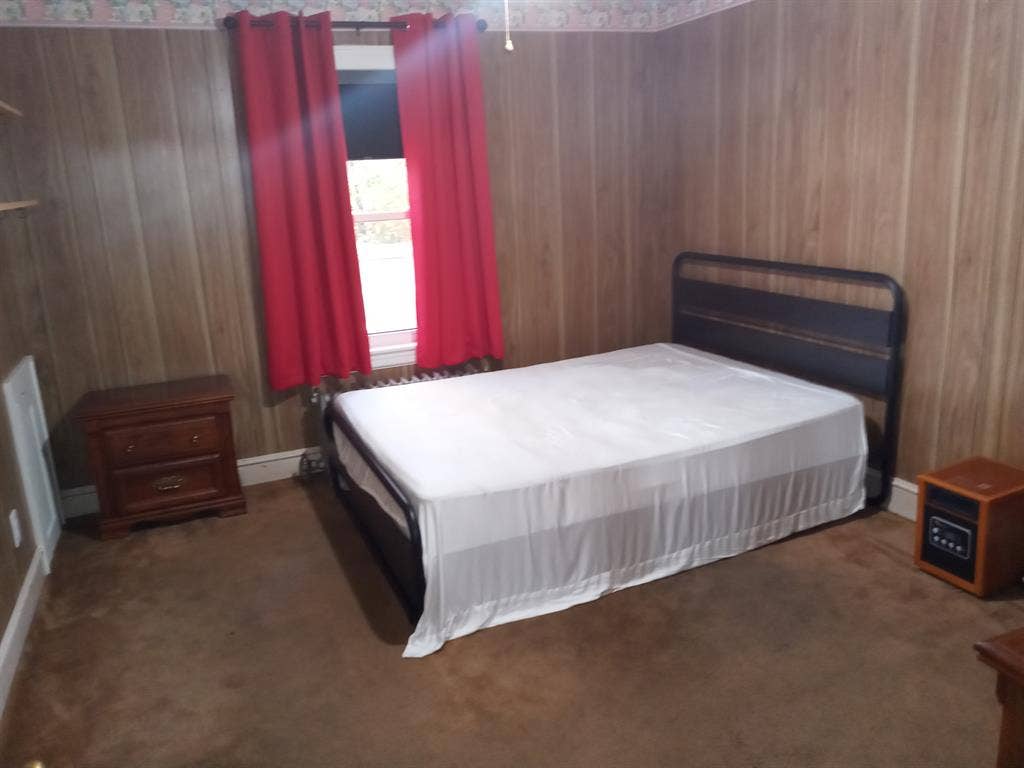Single occupancy furnished bedroom.