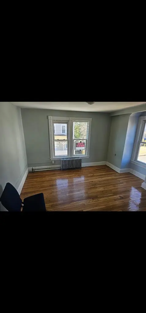 Large room with ample sunlight.