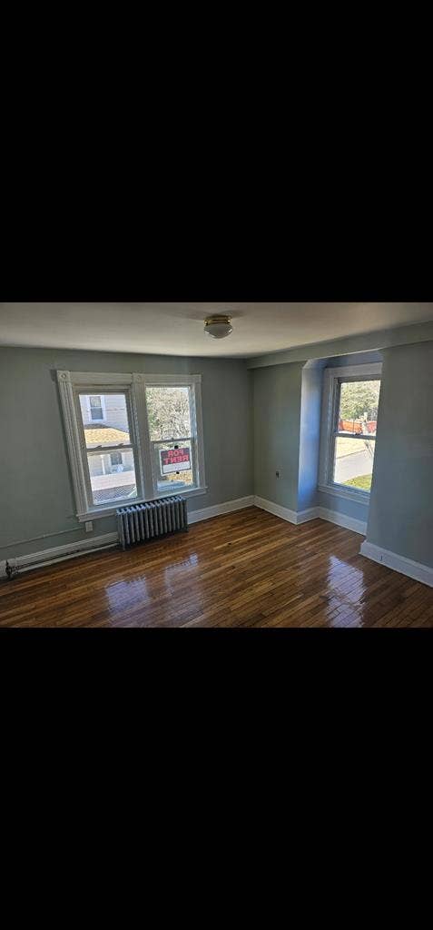 Large room with ample sunlight.