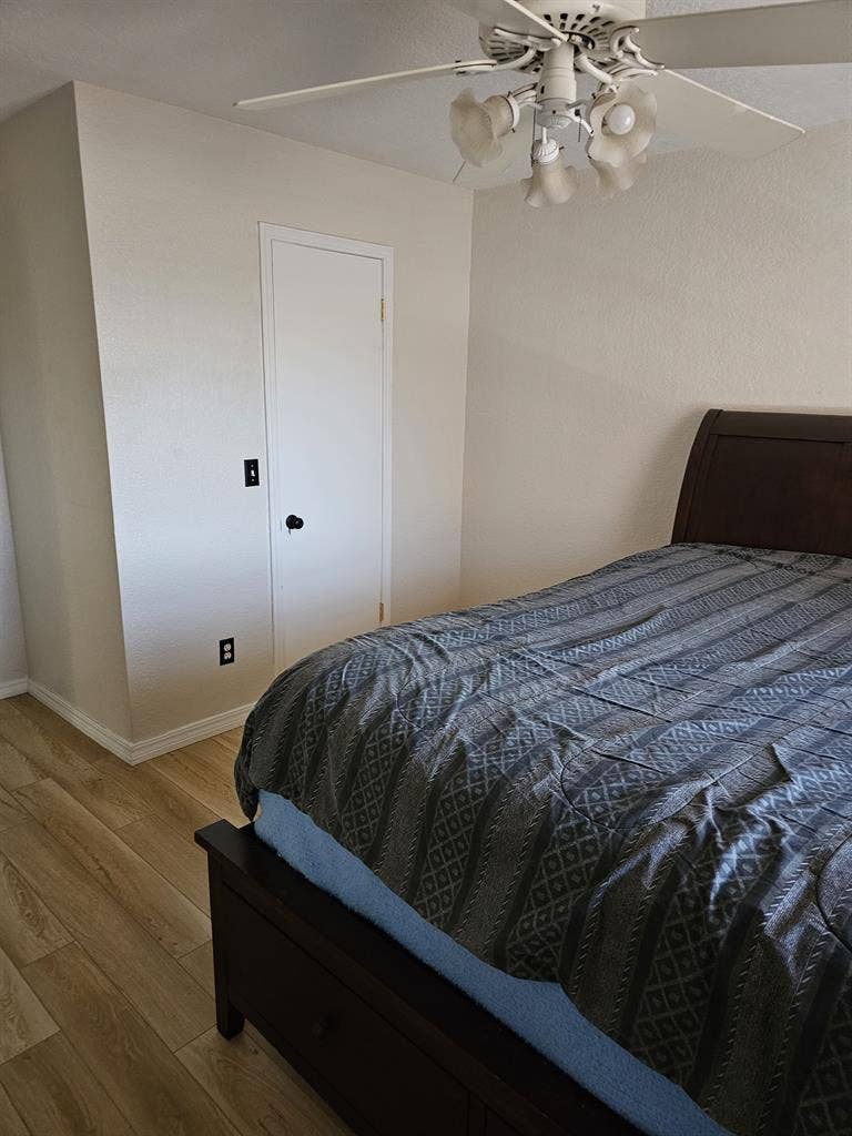 Furnished room with walk in closet.