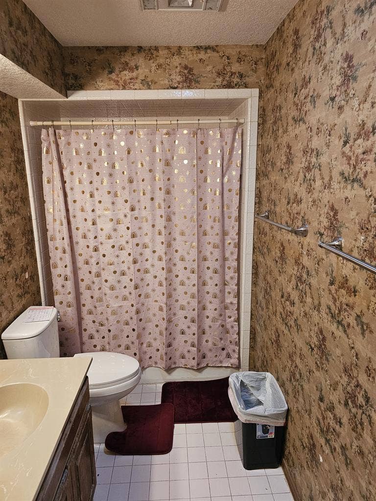 Furnished room with walk in closet.