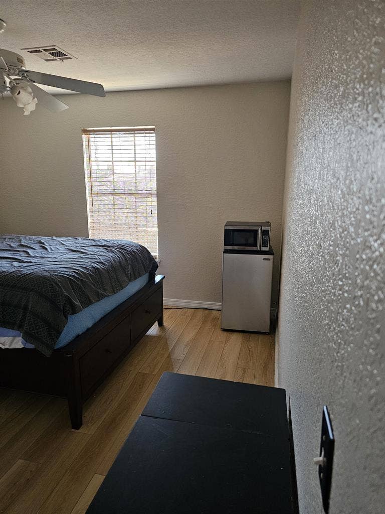 Furnished room with walk in closet.
