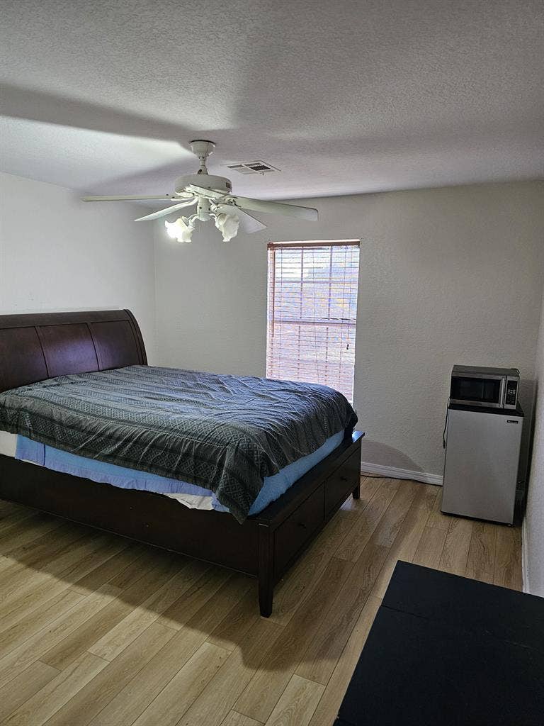 Furnished room with walk in closet.