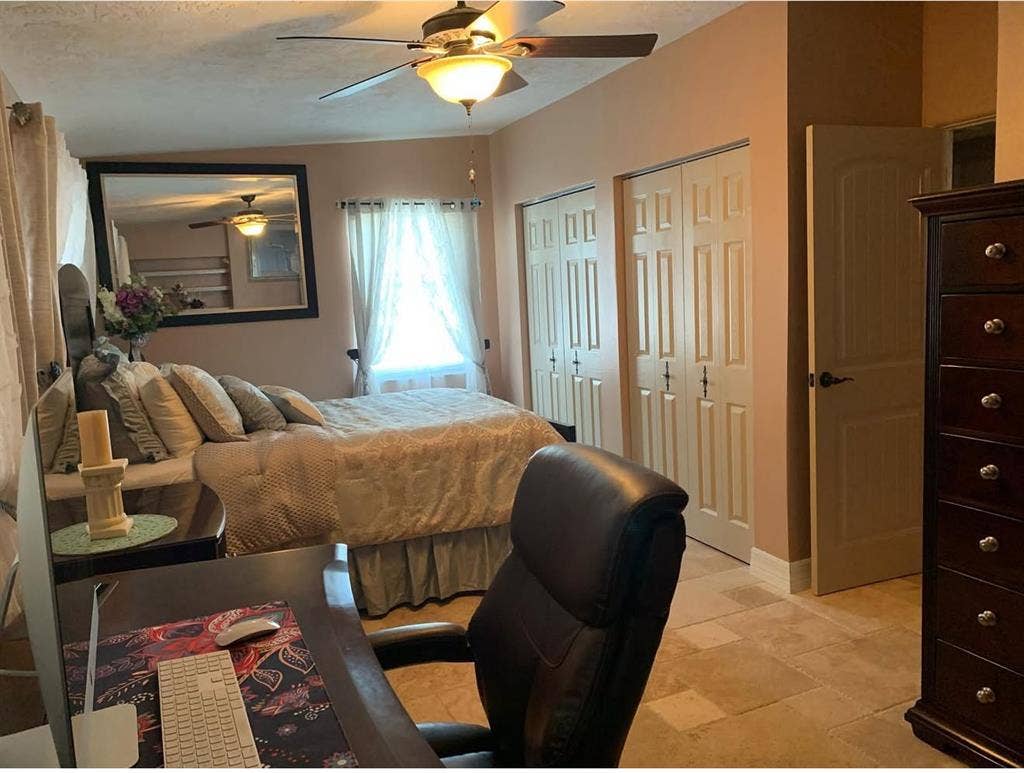 Furnished bedroom w/ private bath