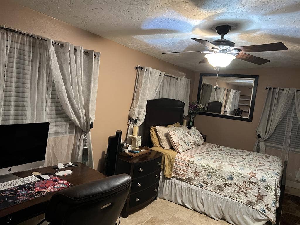 Furnished bedroom w/ private bath