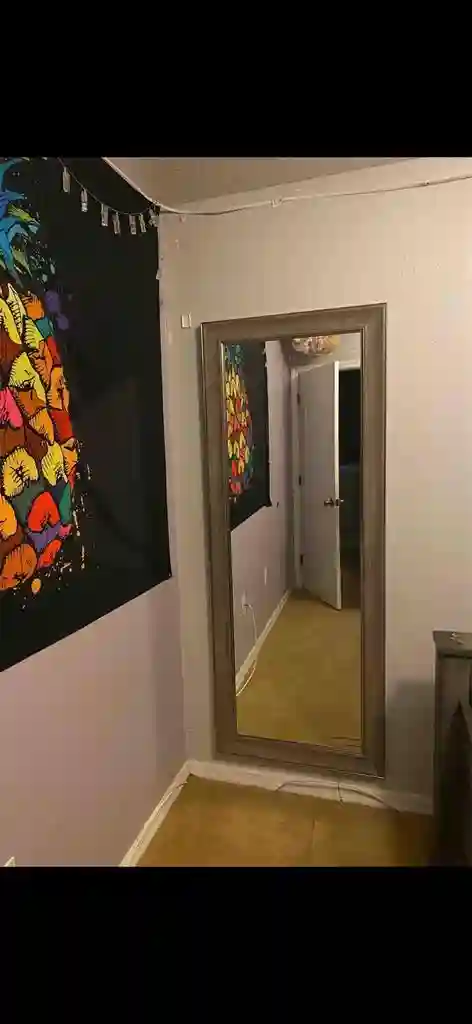 Queen size bed with shared bathroom