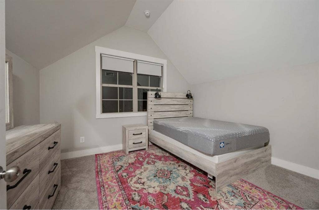 Furnished bedroom with large bath