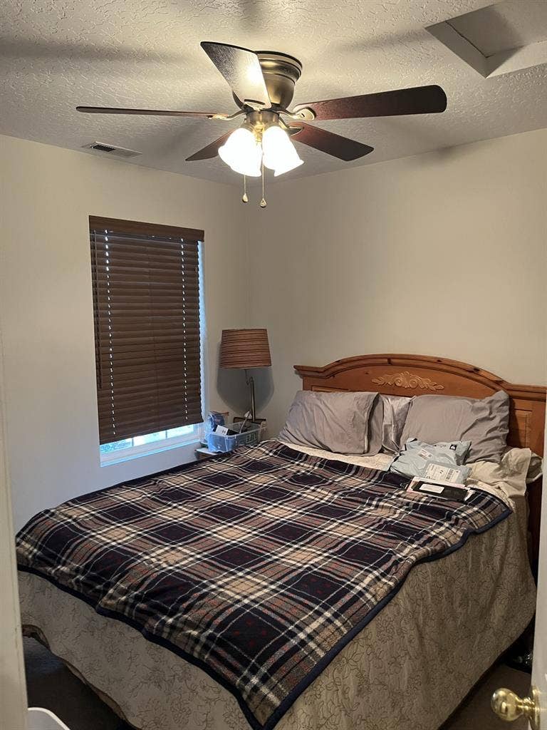 Furnished bedroom private bathroom.