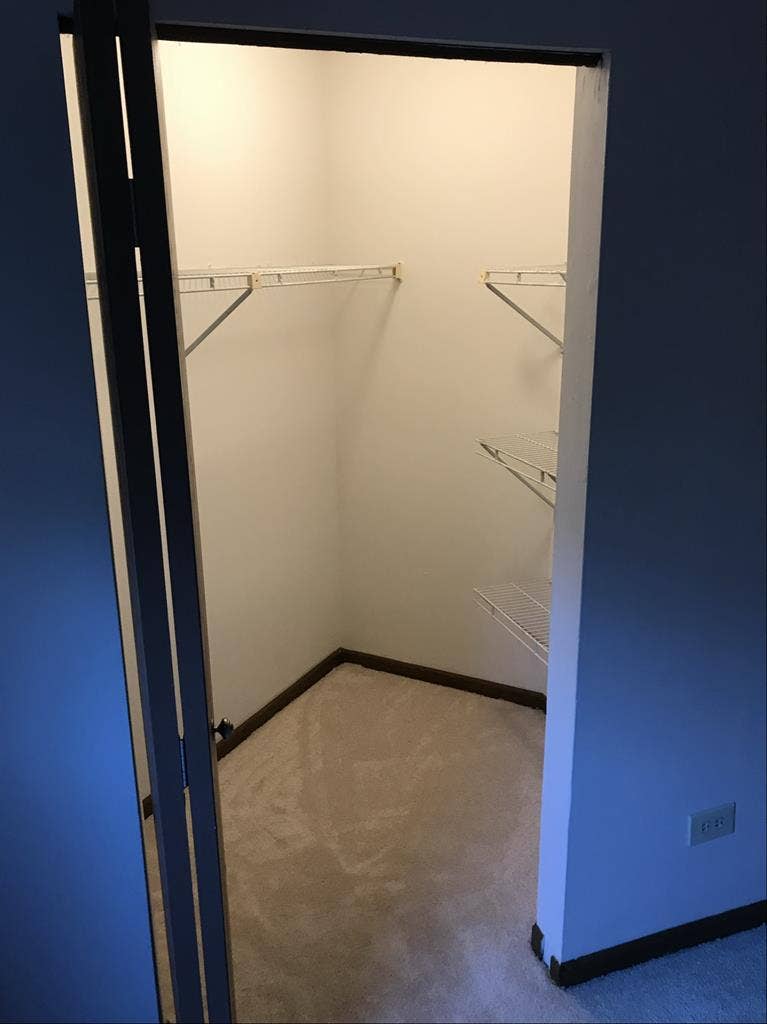 Furnished bedroom w/ walk in closet