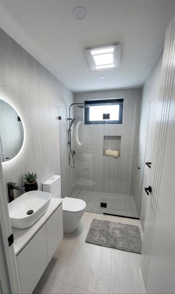 A room with separate bathroom