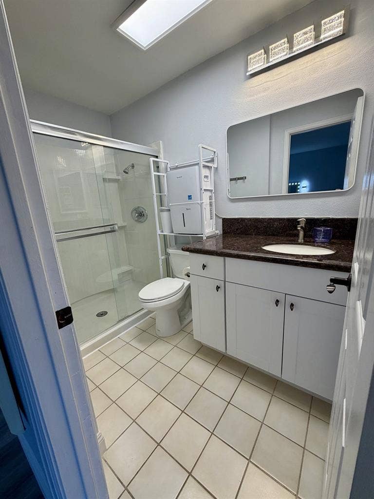Primary bedroom + bath in UTC