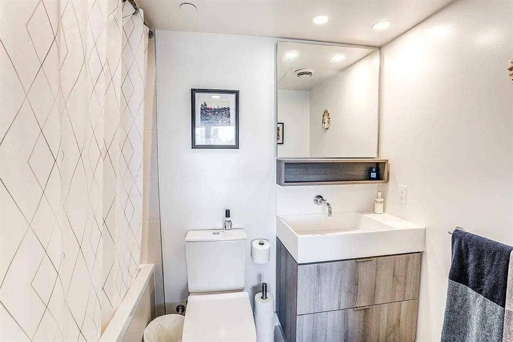 Furnished bedroom with ensuite bath