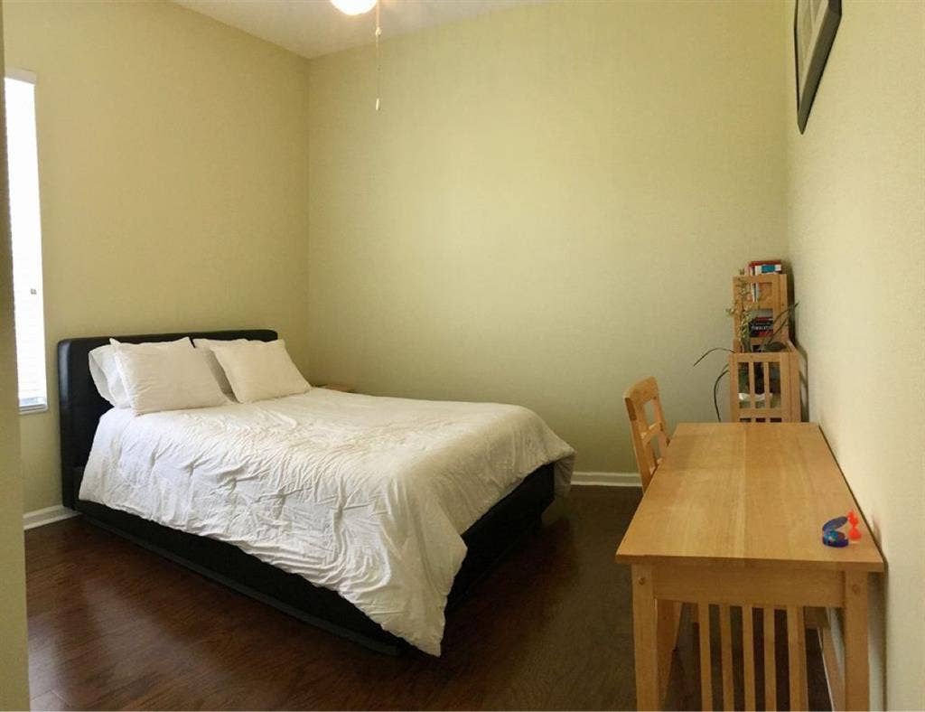 Private furnished bed and bathroom