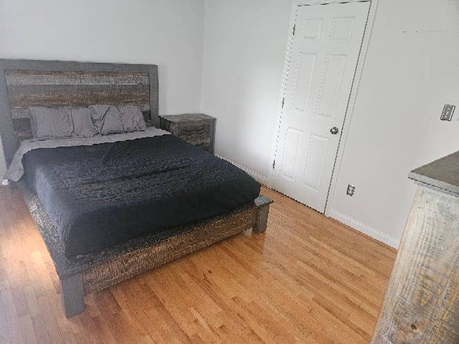 Well lit room with hardwood.