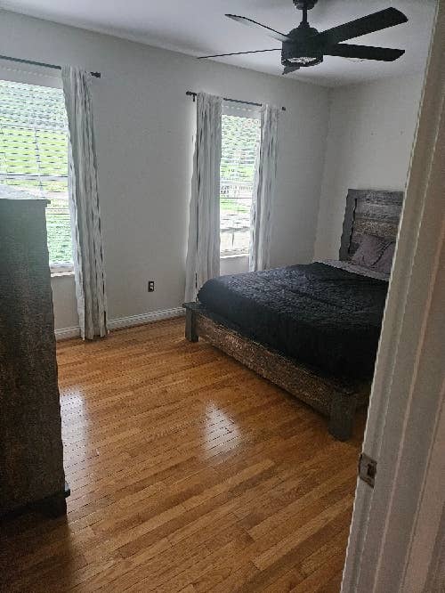 Well lit room with hardwood.