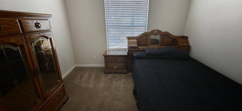 A room in a two bedroom apartment.