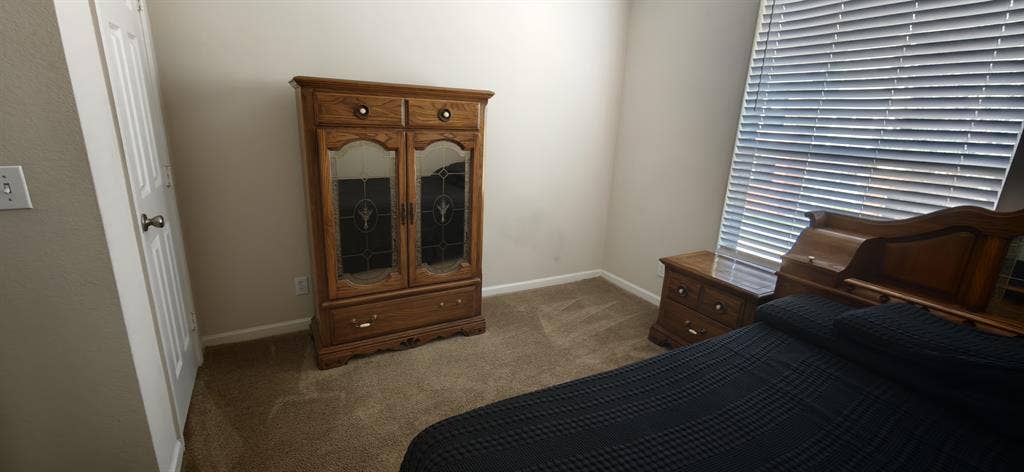 A room in a two bedroom apartment.