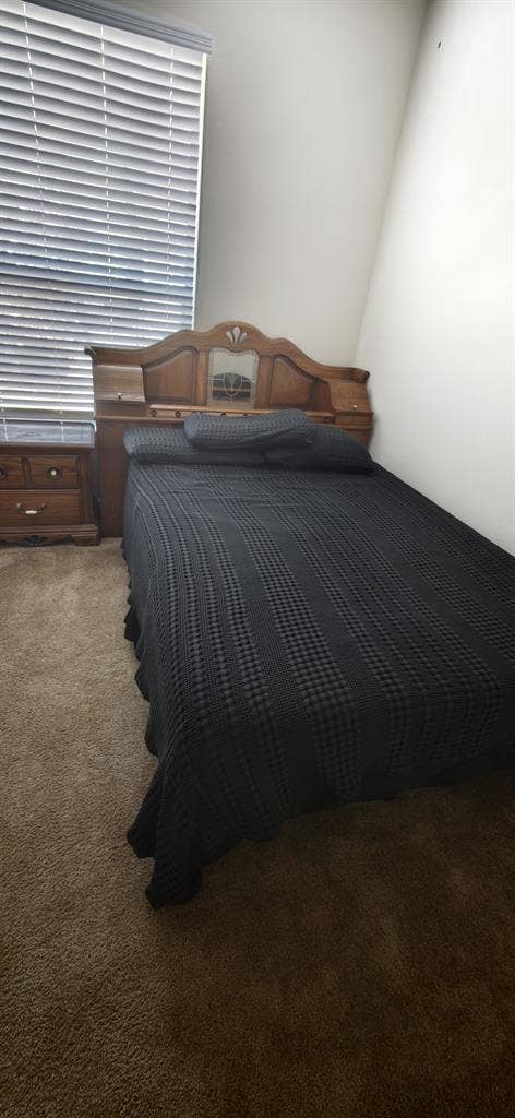 A room in a two bedroom apartment.