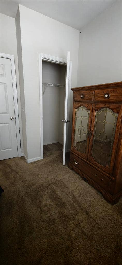 A room in a two bedroom apartment.