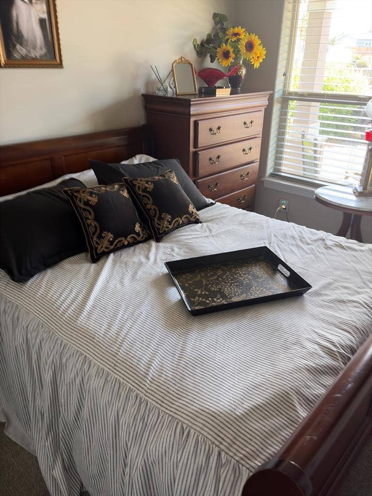 Fully furnished bedroom with TV