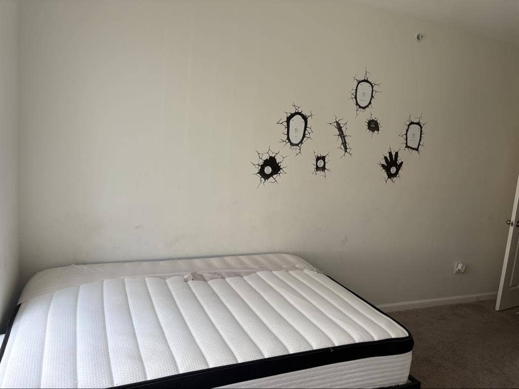 Bedroom with bed & private bathroom