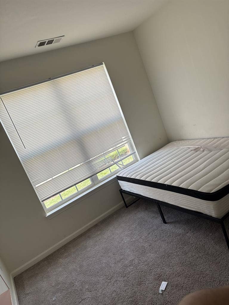 Bedroom with bed & private bathroom
