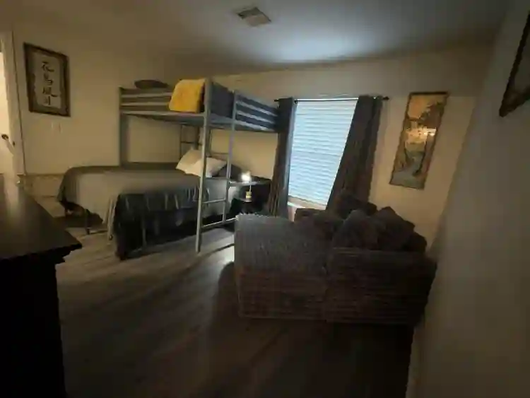 Furnished bedroom with bathroom