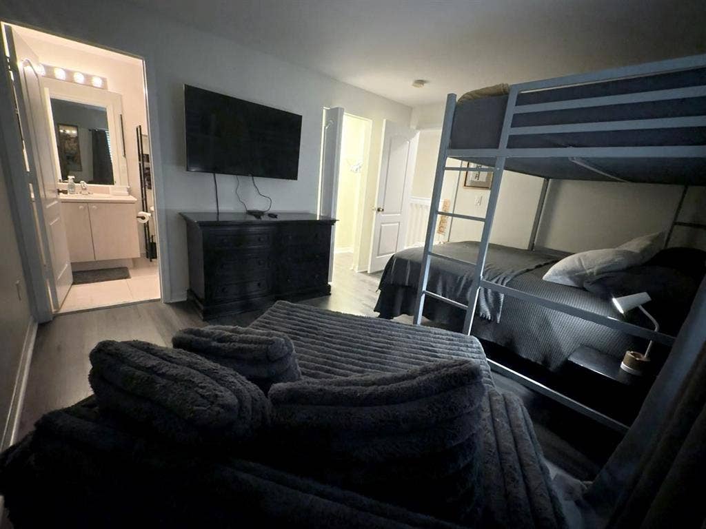 Furnished bedroom with bathroom