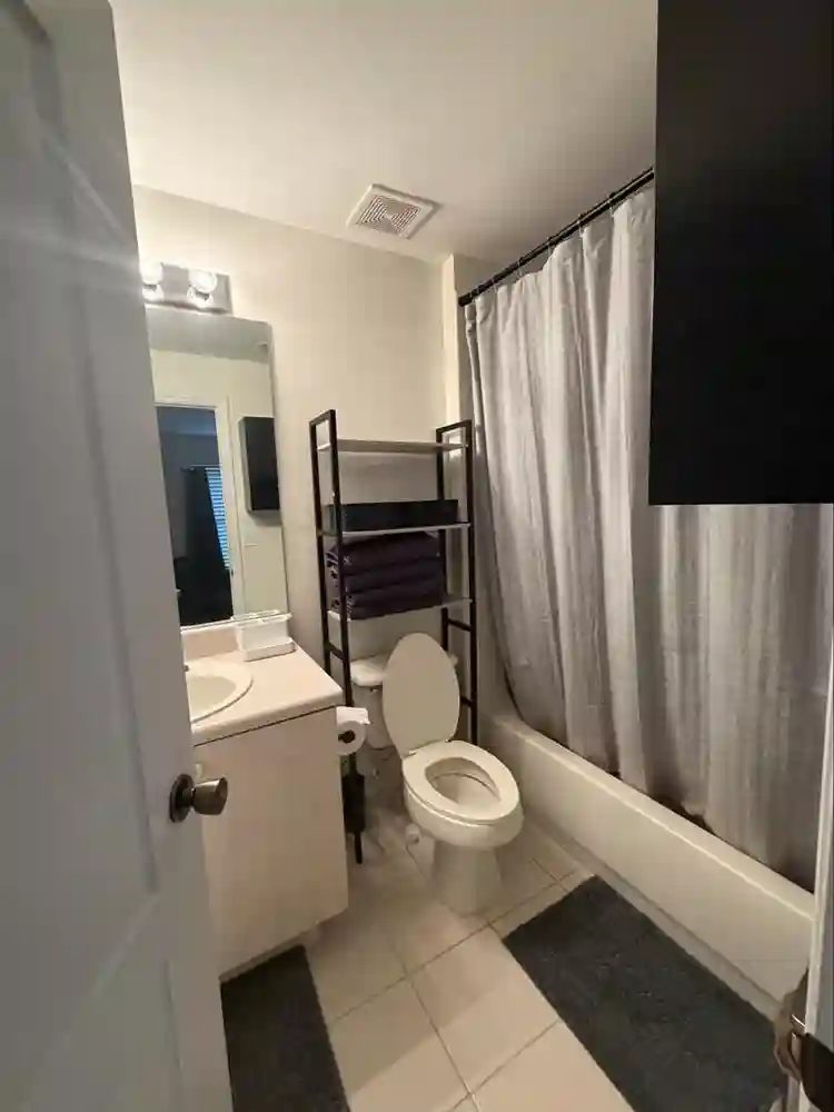 Furnished bedroom with bathroom