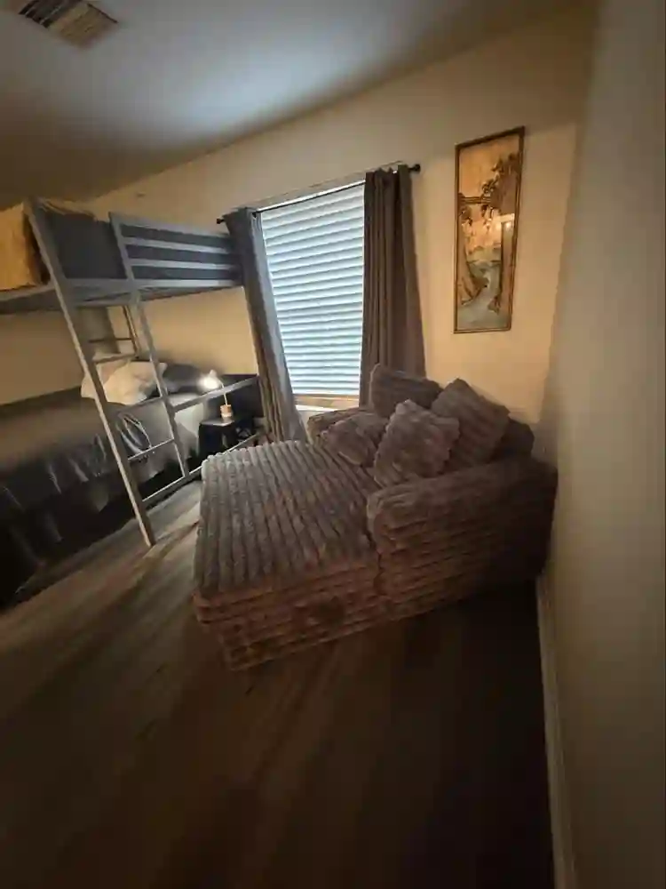 Furnished bedroom with bathroom
