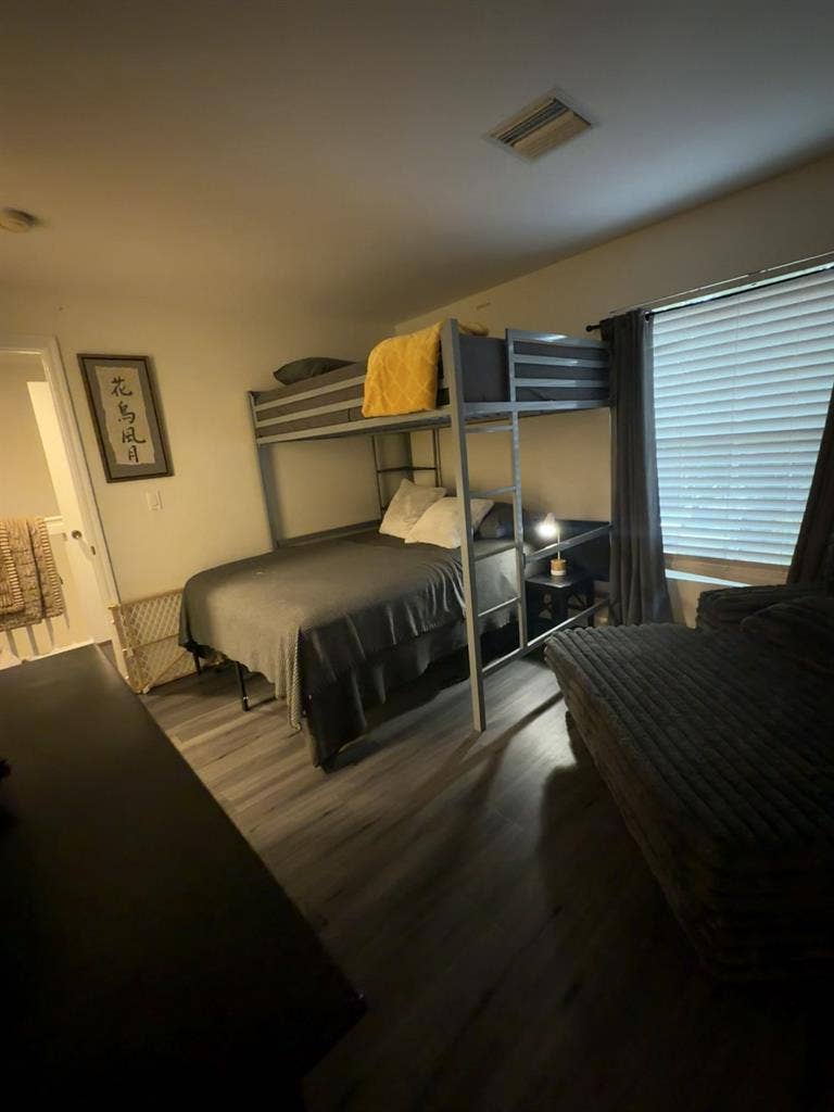Furnished bedroom with bathroom