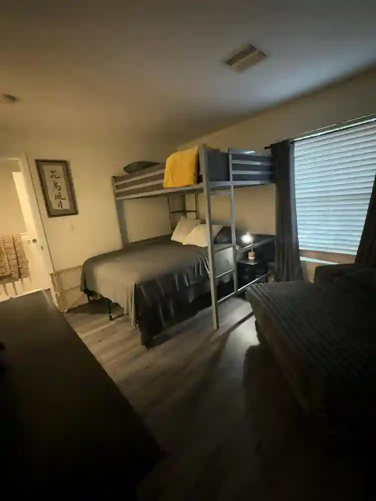 Furnished bedroom with bathroom