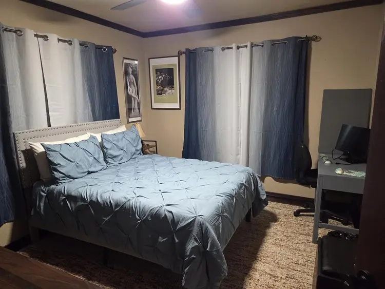 Furnished bedroom with private bath