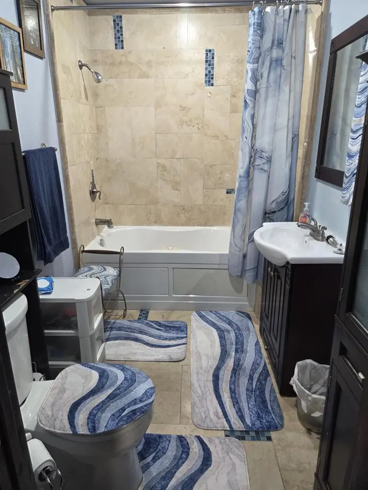 Furnished bedroom with private bath