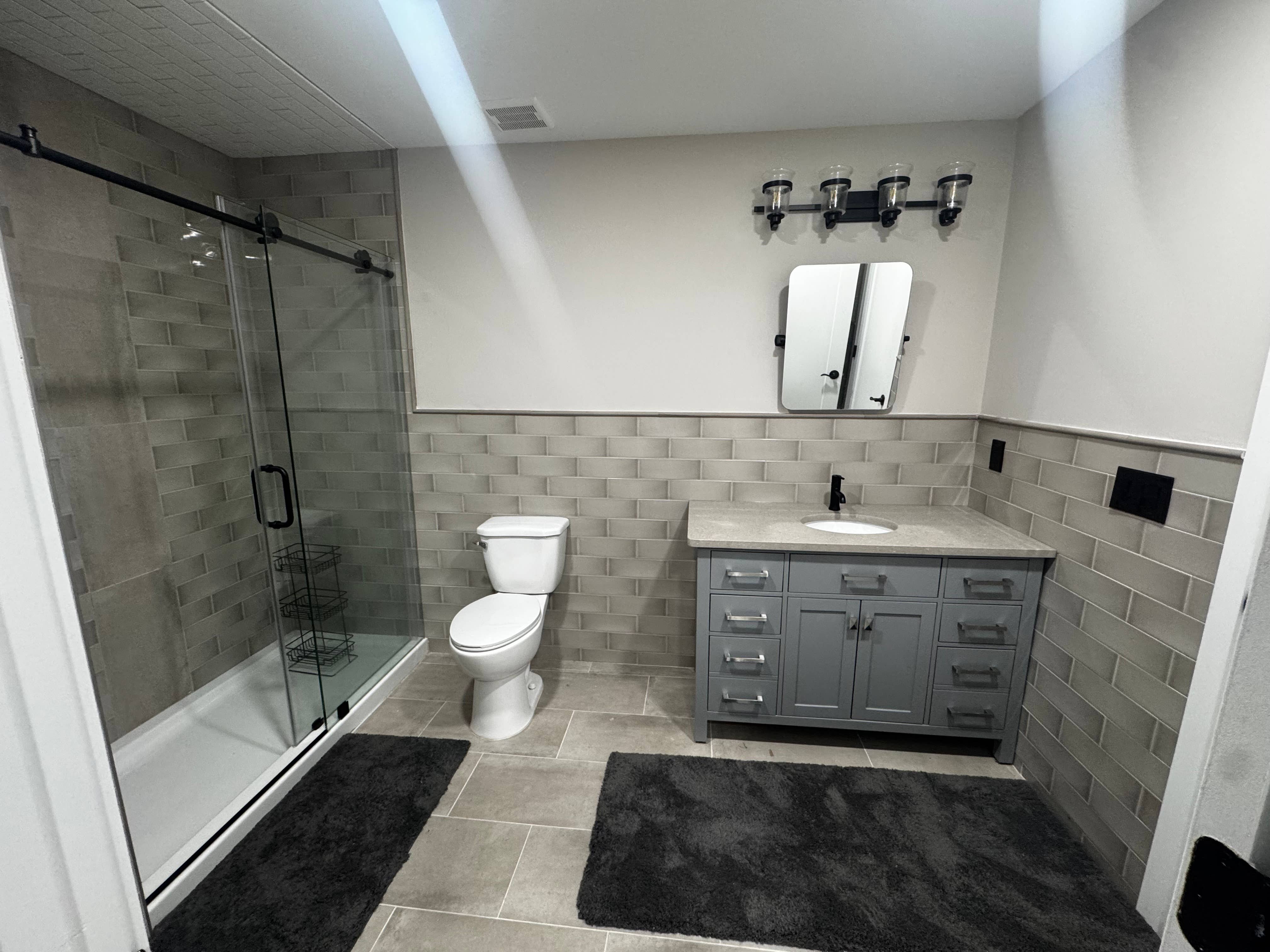 Basement LVL room wPVT Bathroom.
