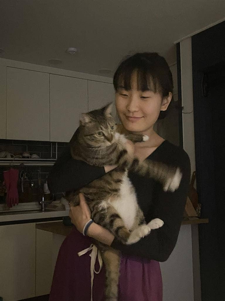 Female student w/ girl cat