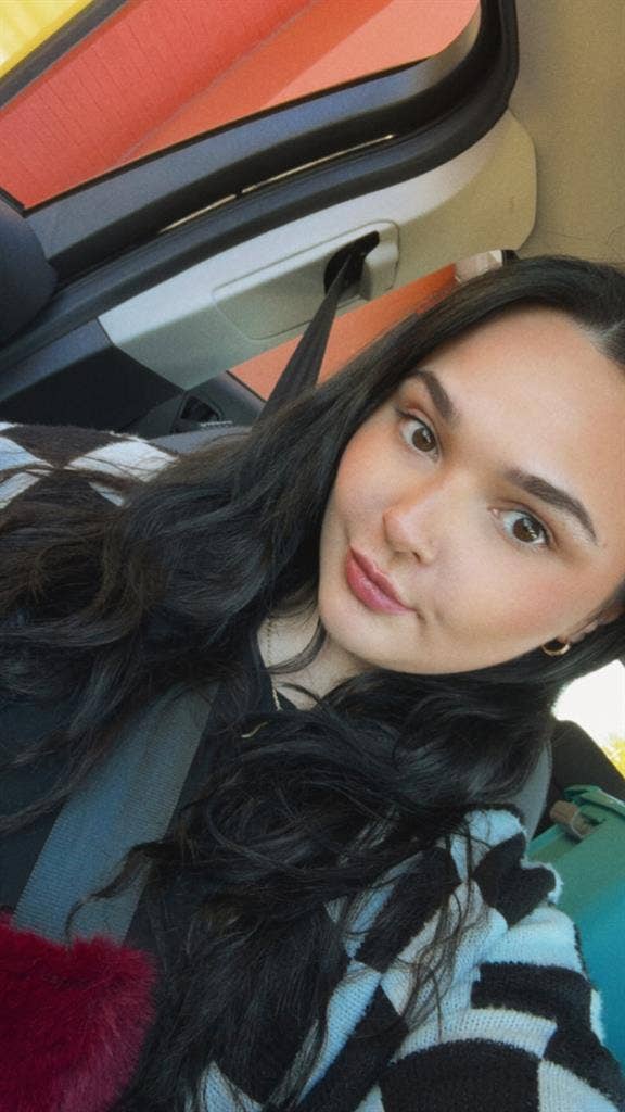 Young female with 2 friendly cats